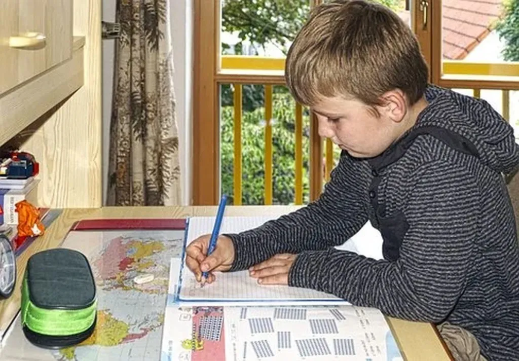 Child With Summer Homework Almost Ready For Final Push To Avoid It