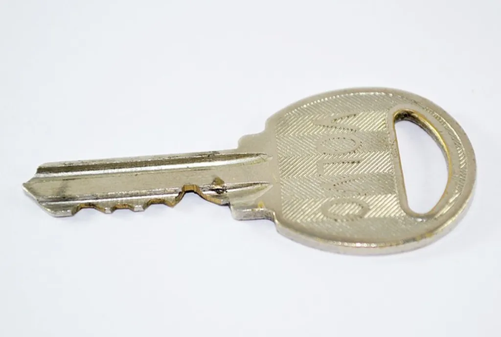 Unfamiliar Key Examined Again, Put Back In Drawer